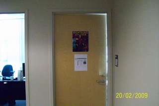 Okal Rel Saga Part 2: Righterous Anger poster on door of Rob van Adrichem's office